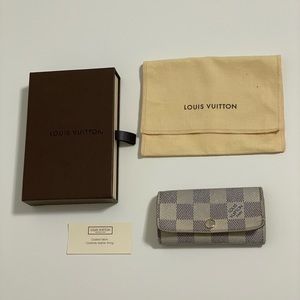 Pre-loved Authentic Louis Vuitton Damien Azur 4 Key Holder
